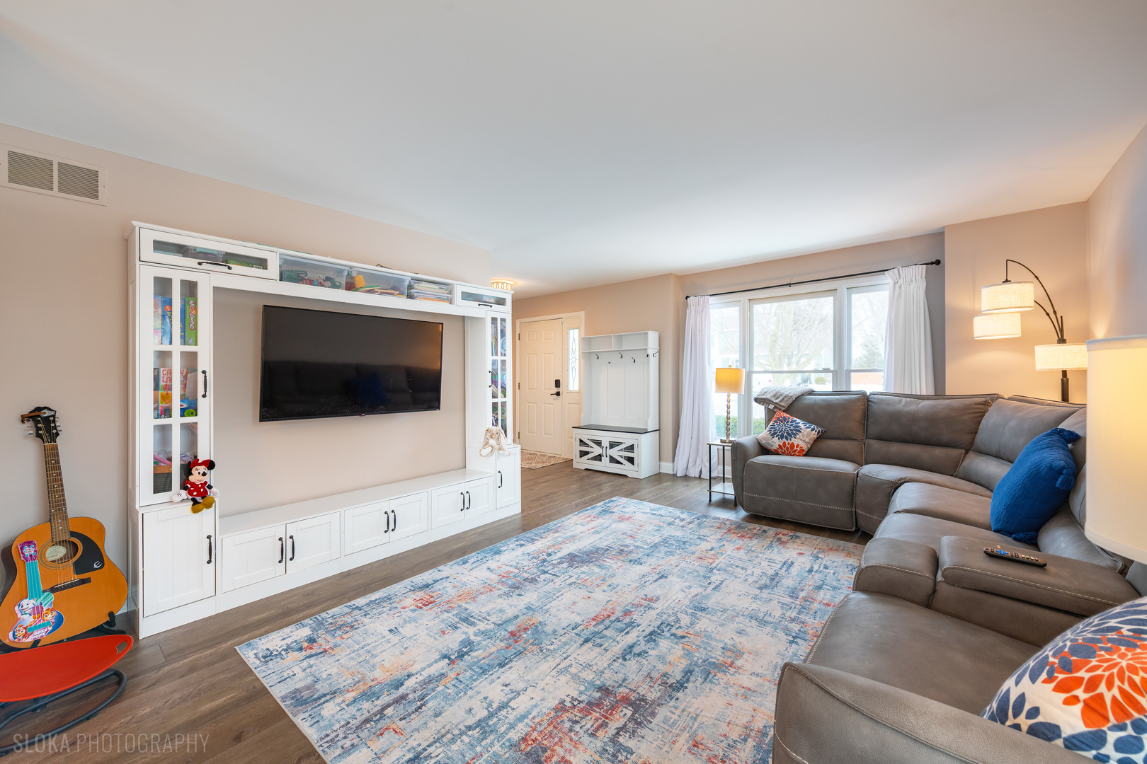 1259 Chickory Ridge Trail Cary, IL 60013 - Photo 2 of 31 a living room with furniture and a flat screen tv