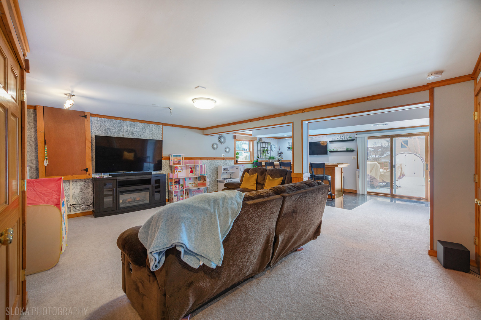 1259 Chickory Ridge Trail Cary, IL 60013 - Photo 22 of 31 a living room with furniture and a flat screen tv