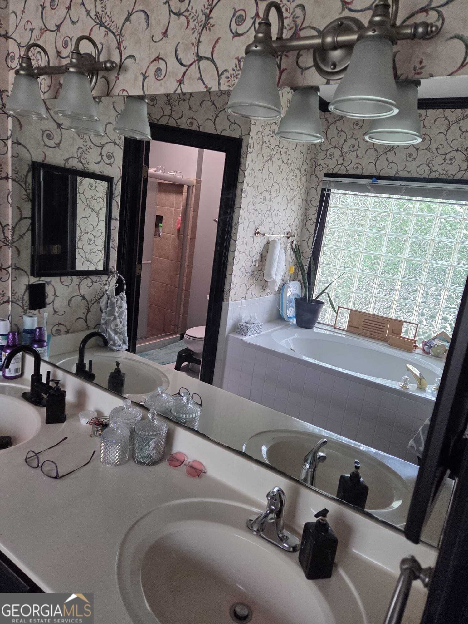 3175 Stinsonville Road Macon, GA 31204 - Photo 12 of 13 a bathroom with a sink and a mirror