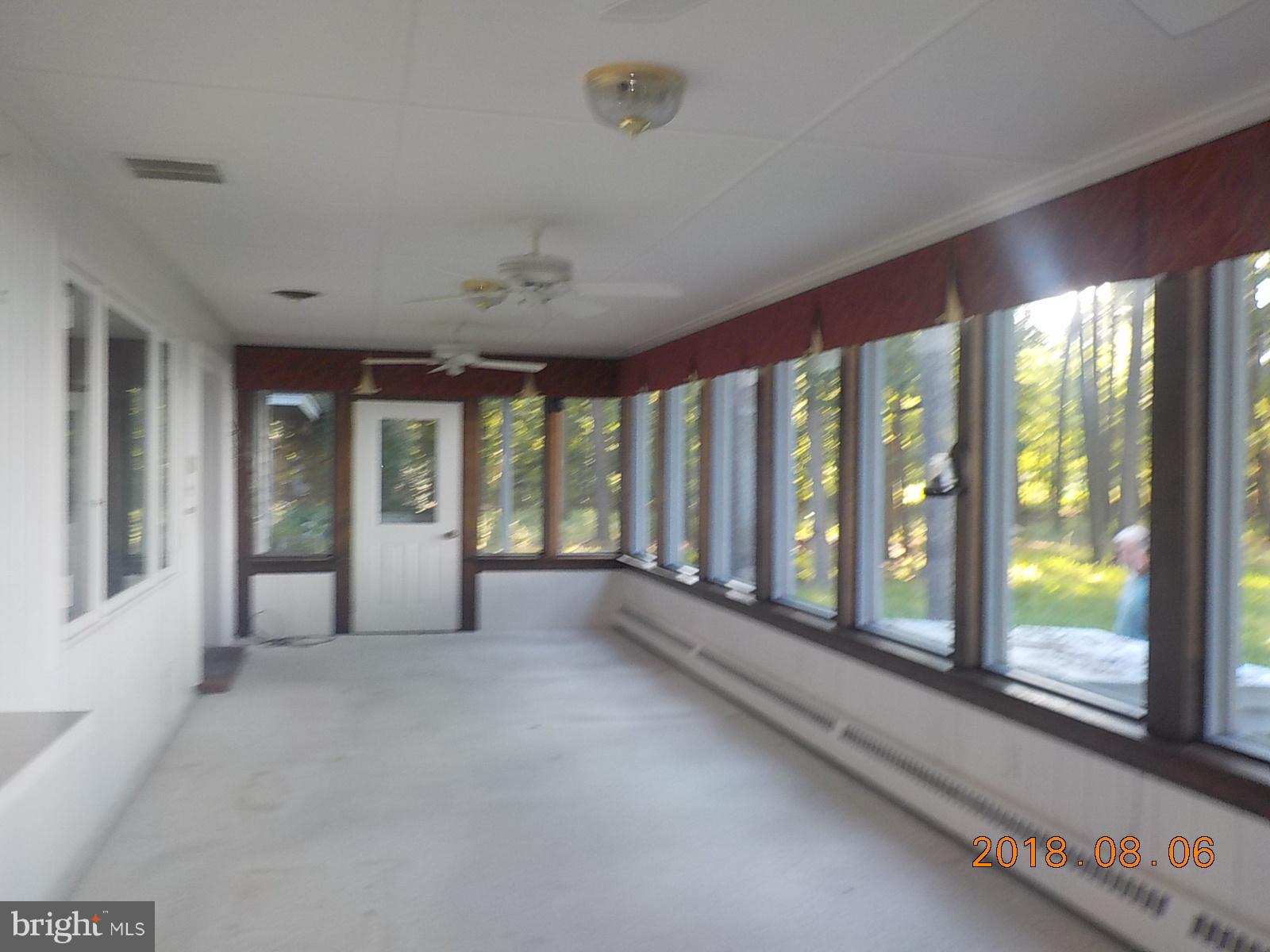 6043 Corners Wharf Road Cambridge, MD 21613 - Photo 22 of 26 heated waterside porch family room)