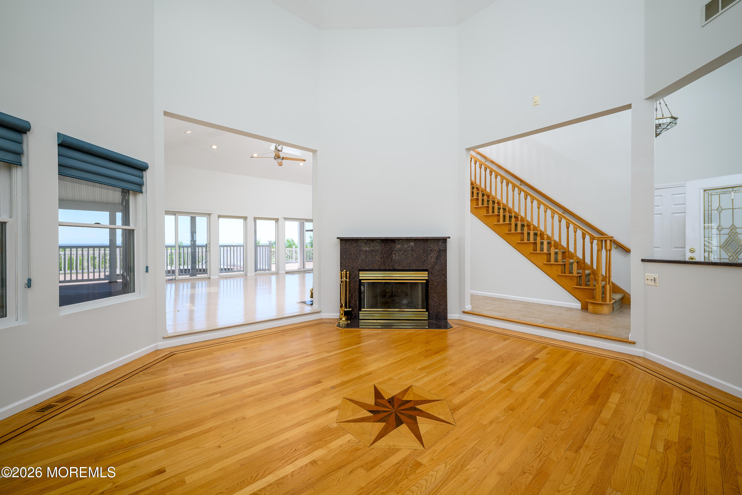 805 Front Street Union Beach, NJ 07735 - Photo 5 of 65 a view of an empty room with a fireplace and a window