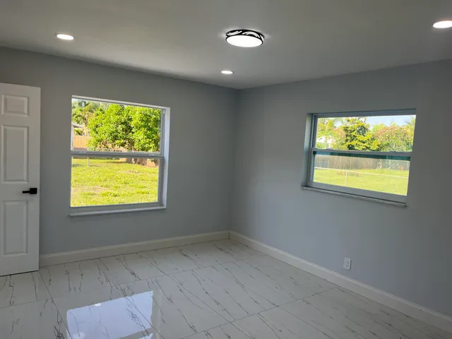 a view of an empty room with a window