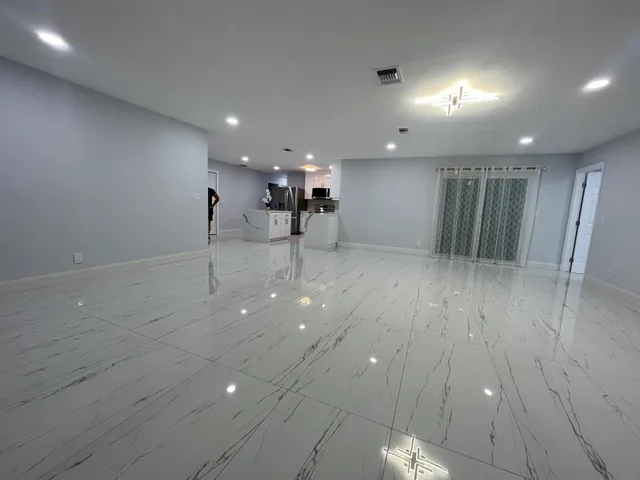 an empty room with wooden floor