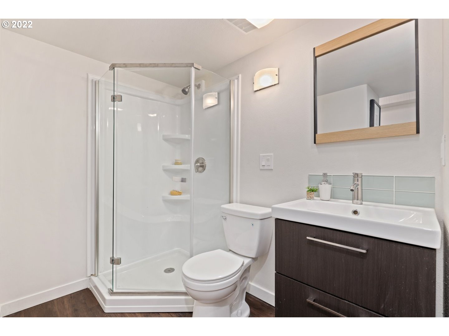 3143 Southwest Sherwood Place Portland, OR 97201 - Photo 19 of 32 a bathroom with a sink a toilet and shower