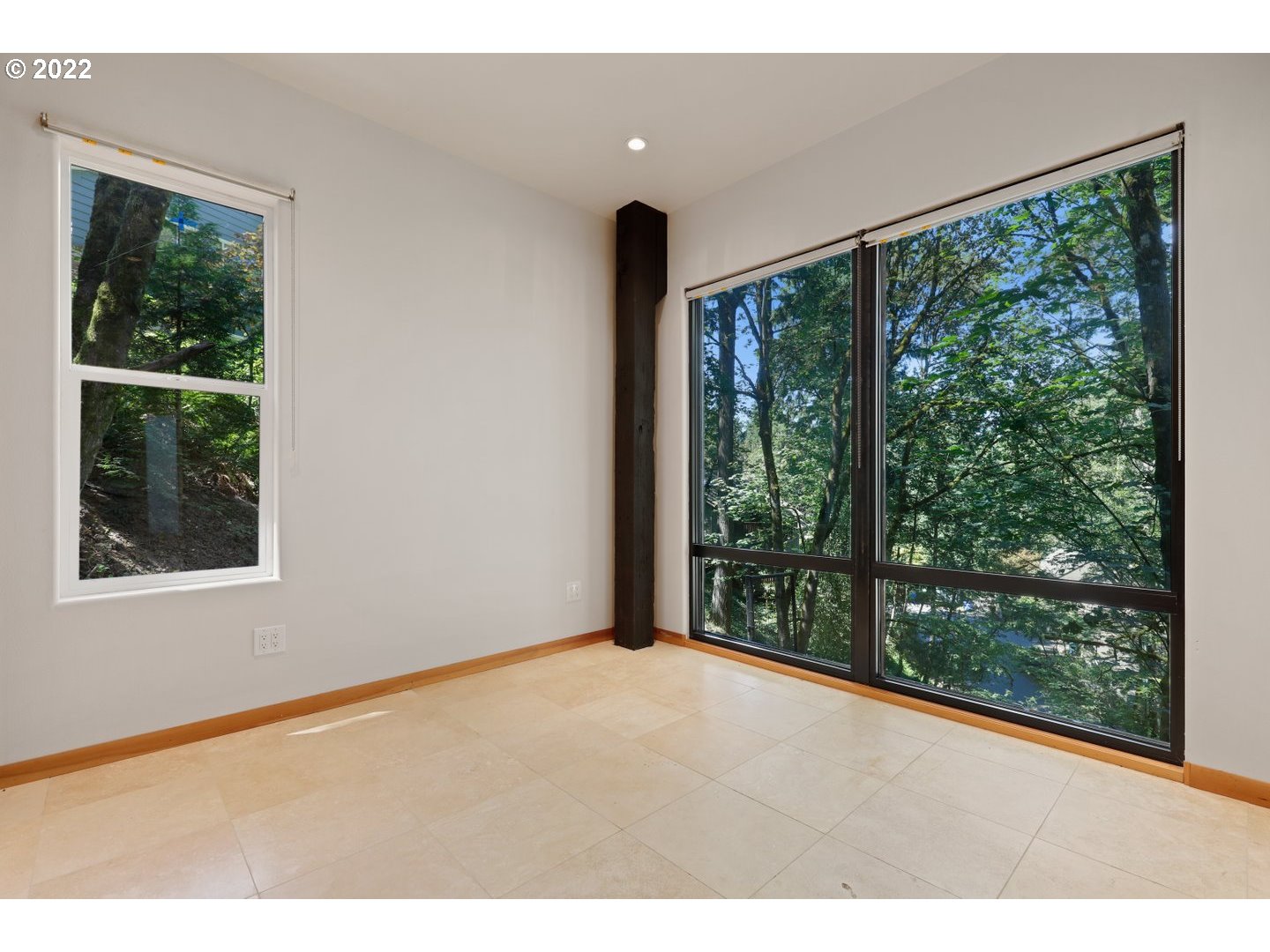 3143 Southwest Sherwood Place Portland, OR 97201 - Photo 22 of 32 a view of an empty room with wooden floor and a window