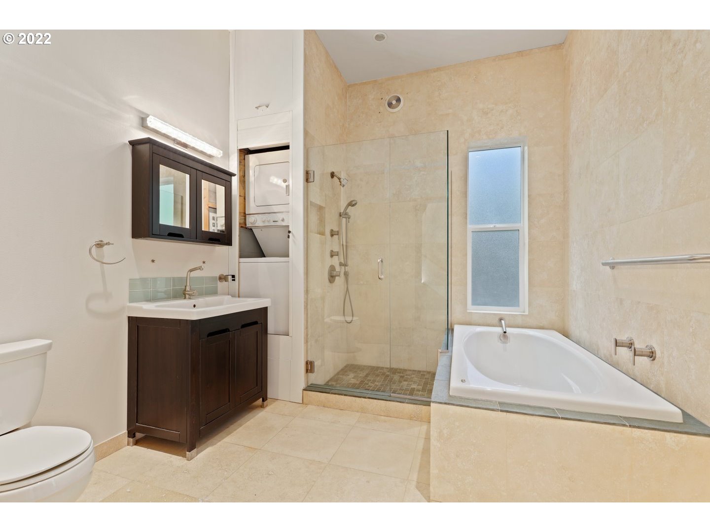 3143 Southwest Sherwood Place Portland, OR 97201 - Photo 24 of 32 a bathroom with a sink a toilet and shower