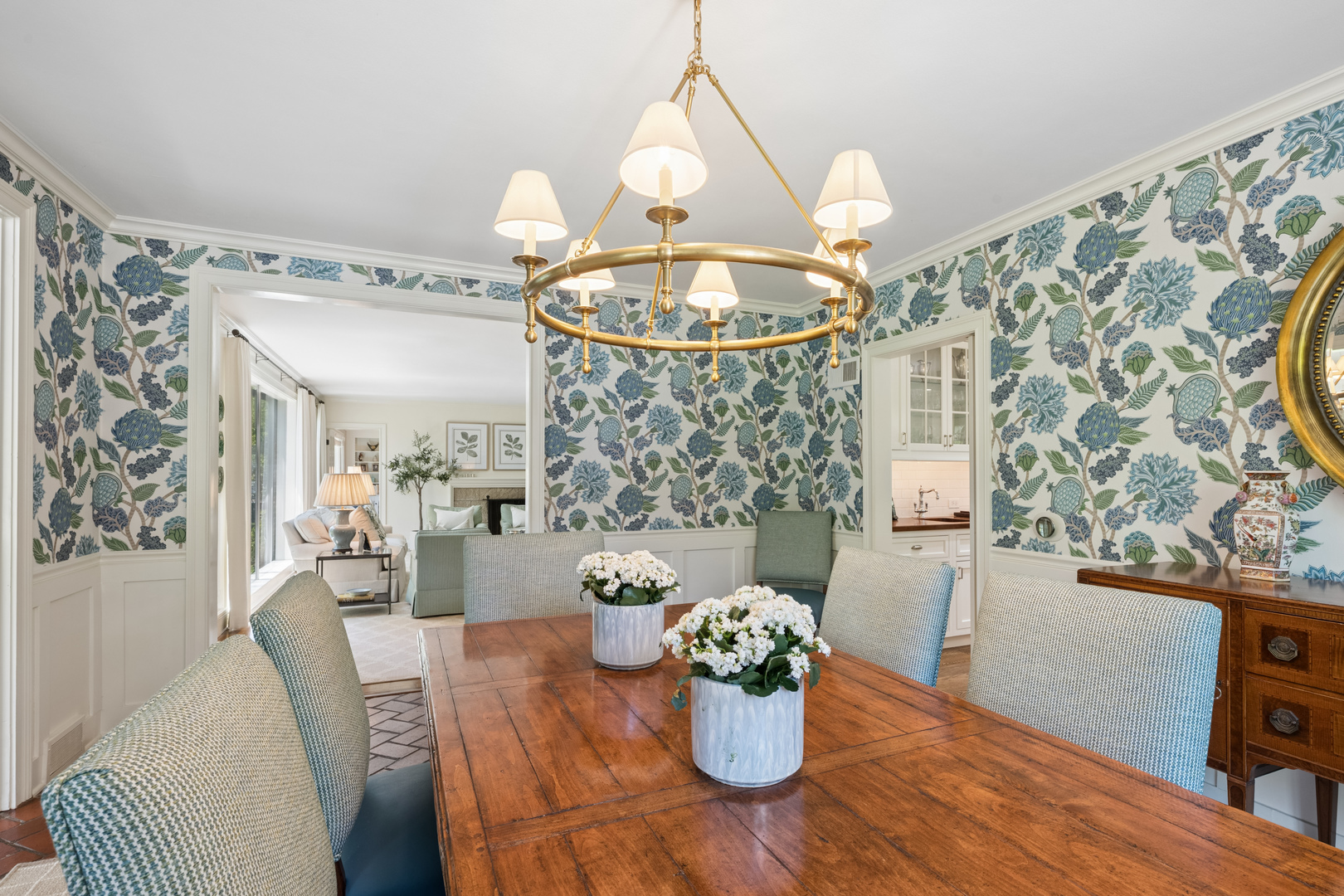 936 Sunset Road Winnetka, IL 60093 - Photo 14 of 50 a view of a dining room with furniture and a chandelier
