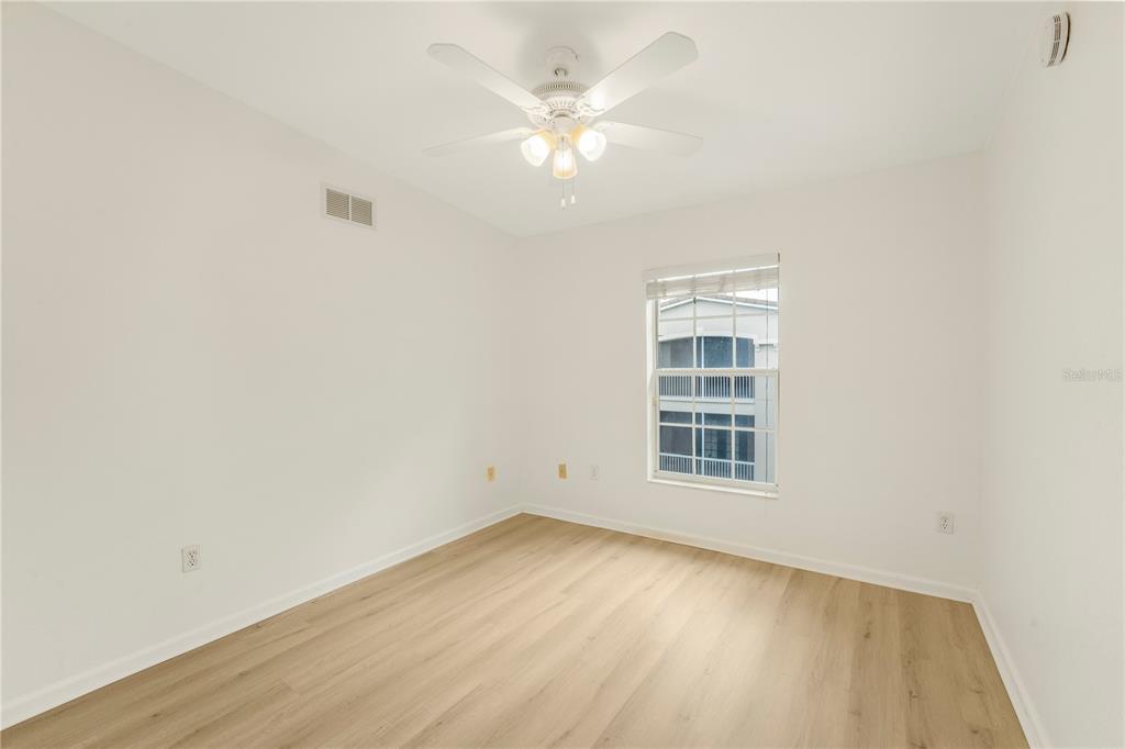 3351 Whitestone Circle, Unit 304 Kissimmee, FL 34741 - Photo 11 of 21 an empty room with a window and a ceiling fan