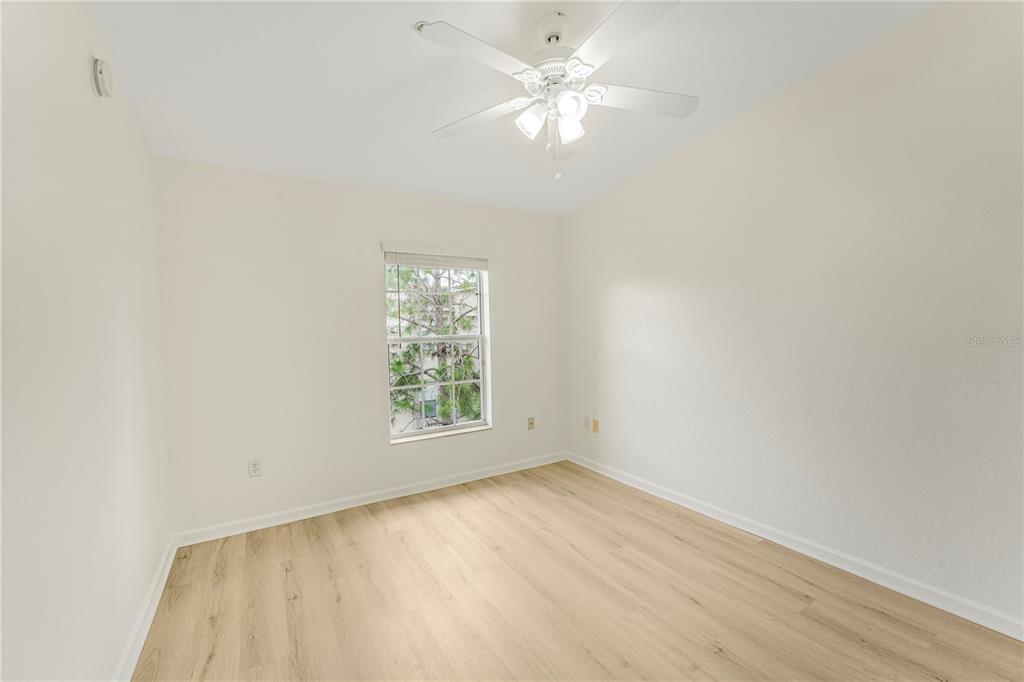 3351 Whitestone Circle, Unit 304 Kissimmee, FL 34741 - Photo 13 of 21 an empty room with a window and a ceiling fan