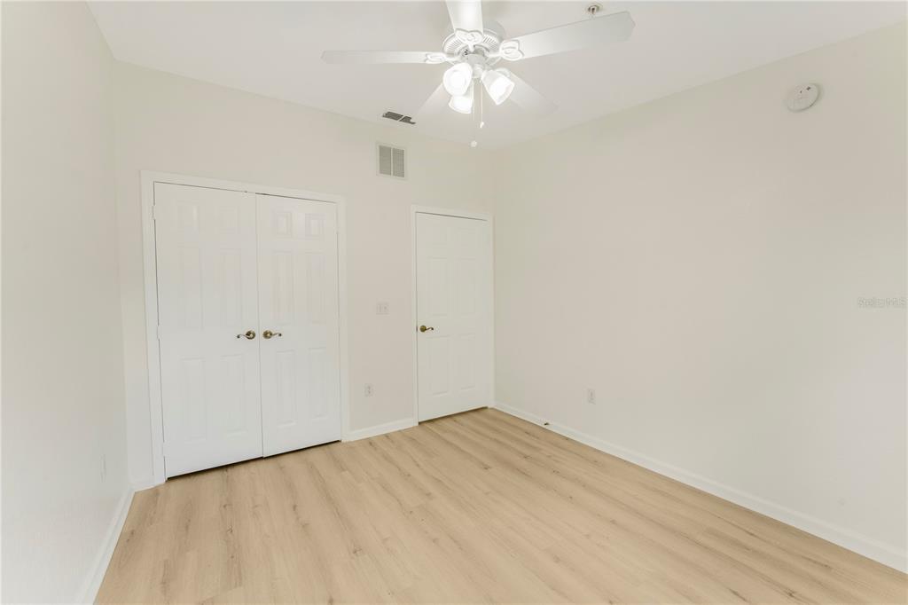 3351 Whitestone Circle, Unit 304 Kissimmee, FL 34741 - Photo 14 of 21 wooden floor in an empty room
