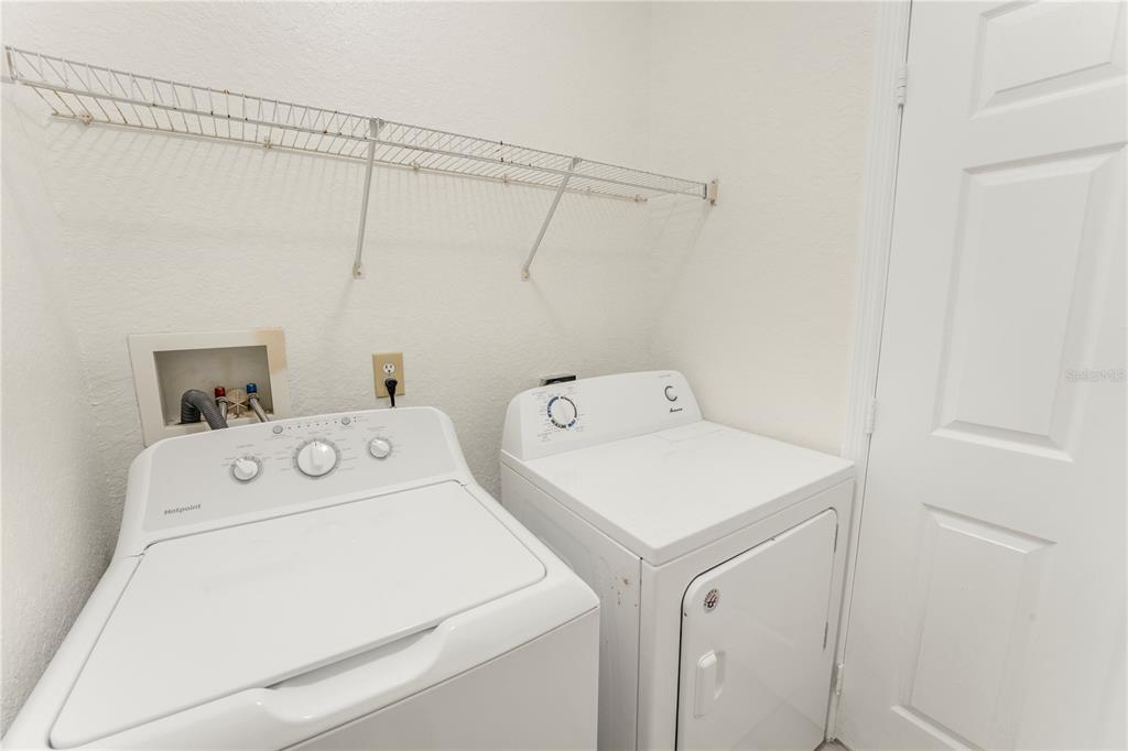 3351 Whitestone Circle, Unit 304 Kissimmee, FL 34741 - Photo 15 of 21 a utility room with dryer and washer