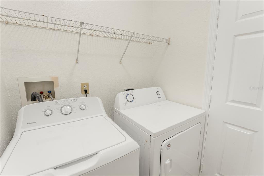 3351 Whitestone Circle, Unit 304 Kissimmee, FL 34741 - Photo 16 of 21 a utility room with dryer and washer
