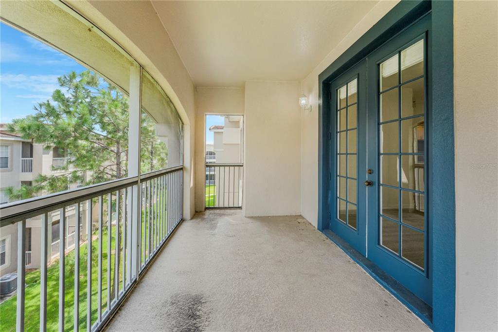 3351 Whitestone Circle, Unit 304 Kissimmee, FL 34741 - Photo 18 of 21 a view of a glass door and porch