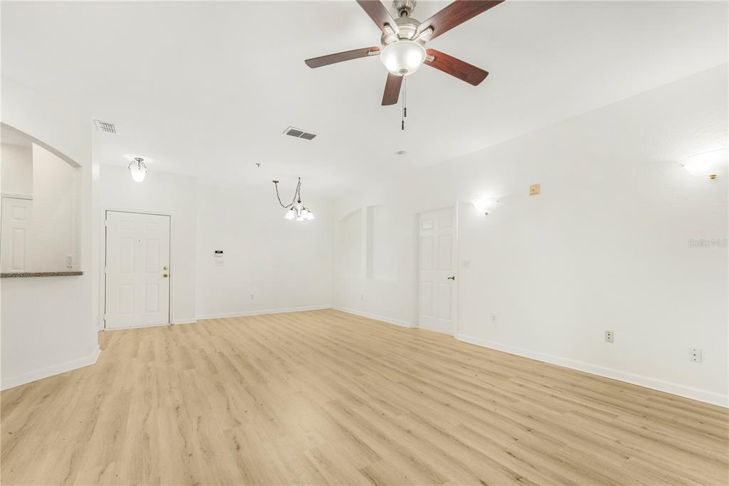3351 Whitestone Circle, Unit 304 Kissimmee, FL 34741 - Photo 3 of 21 a view of an empty room with a ceiling fan