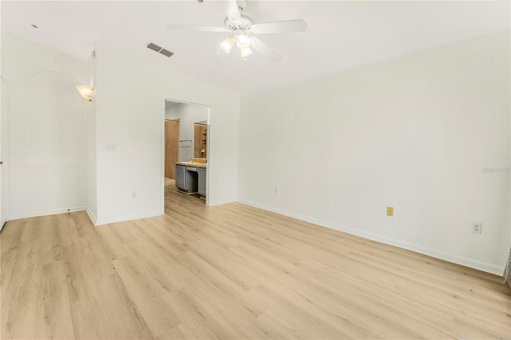 3351 Whitestone Circle, Unit 304 Kissimmee, FL 34741 - Photo 7 of 21 a view of empty room with wooden floor
