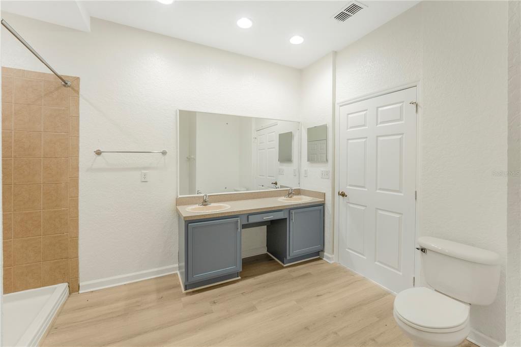 3351 Whitestone Circle, Unit 304 Kissimmee, FL 34741 - Photo 9 of 21 a view of bathroom with a sink and mirror