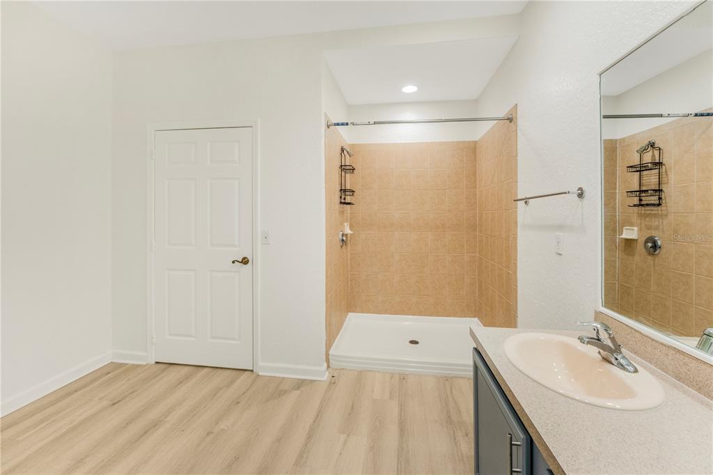 3351 Whitestone Circle, Unit 304 Kissimmee, FL 34741 - Photo 10 of 21 a bathroom with a sink and a mirror