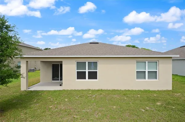 a view of house with yard