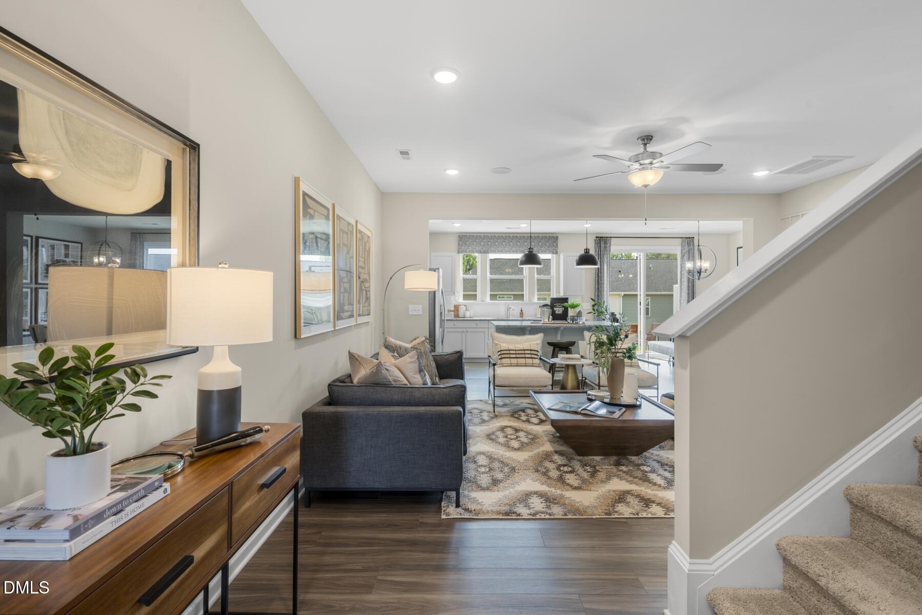 136 Lennei Lane Garner, NC 27529 - Photo 12 of 30 a living room with furniture and a chandelier