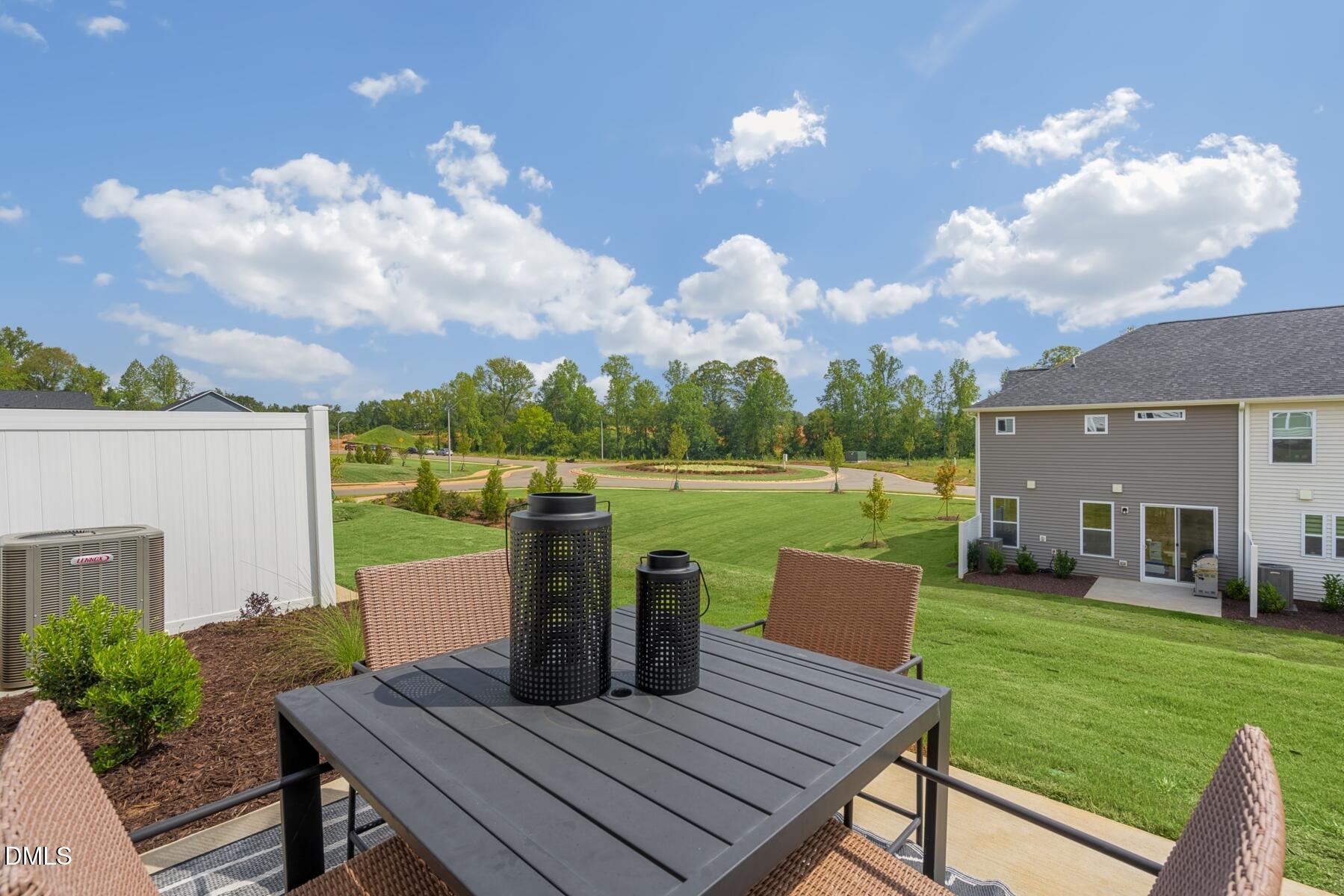 136 Lennei Lane Garner, NC 27529 - Photo 29 of 30 a view of a deck with couches table and chairs and a yard