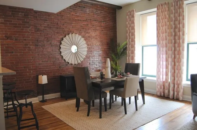 a view of a dining room with furniture and window