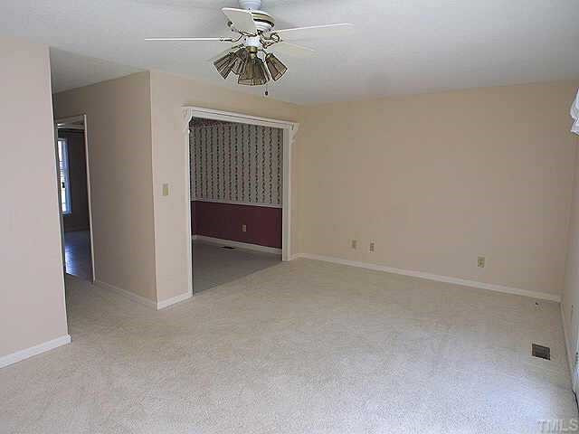 8019 Perry Creek Road Raleigh, NC 27616 - Photo 1 of 1 View of Living rm. showing the dining rm, and hall Exterior Front