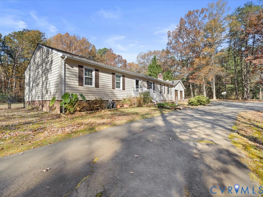 15415 Hopeful Church Road Bumpass, VA 23024 - Photo 1 of 27 a front view of a house with a yard