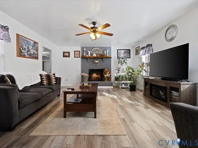a living room with furniture and a fireplace