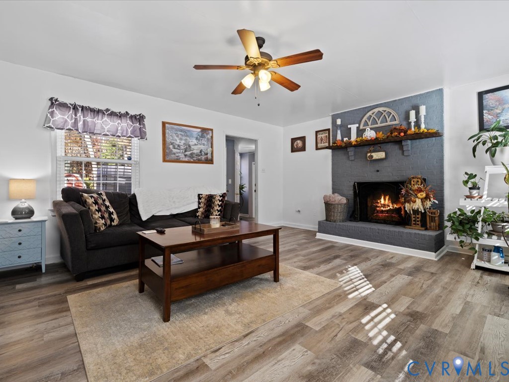 15415 Hopeful Church Road Bumpass, VA 23024 - Photo 13 of 27 a living room with furniture and a fireplace