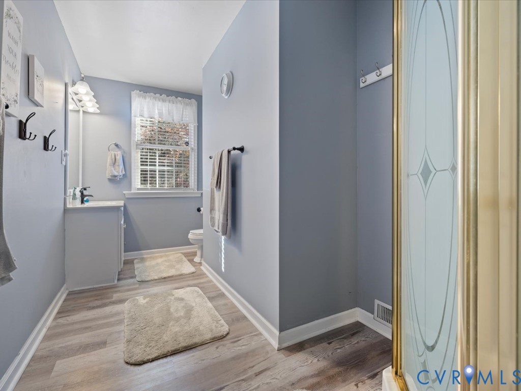 15415 Hopeful Church Road Bumpass, VA 23024 - Photo 14 of 27 a view of livingroom with window and hardwood floor