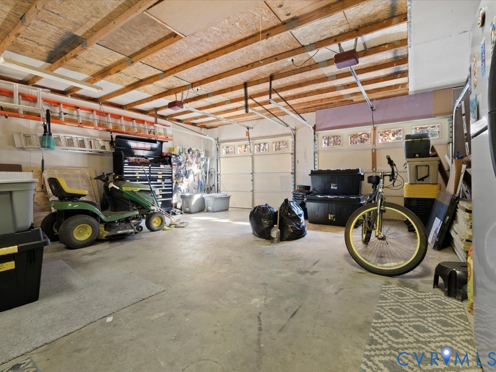 15415 Hopeful Church Road Bumpass, VA 23024 - Photo 16 of 27 a view of a garage with parked cars