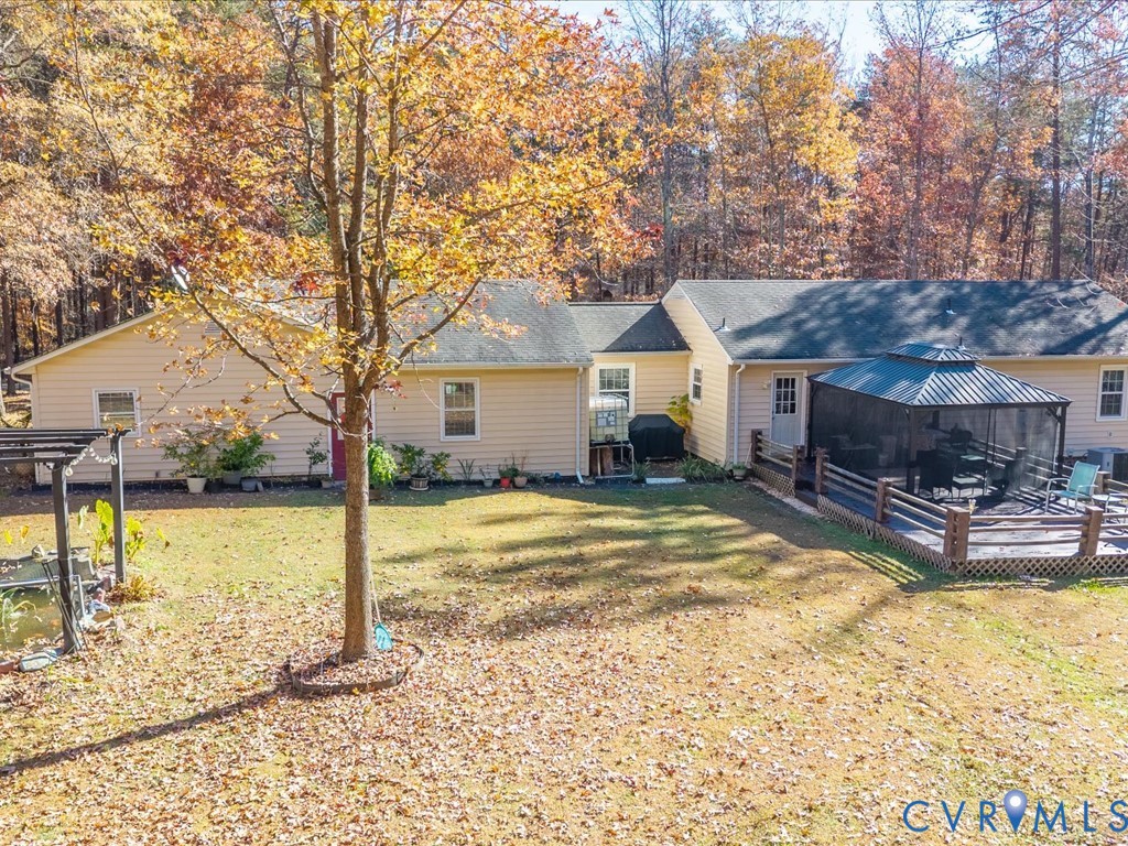 15415 Hopeful Church Road Bumpass, VA 23024 - Photo 22 of 27 a view of a house with swimming pool and sitting area