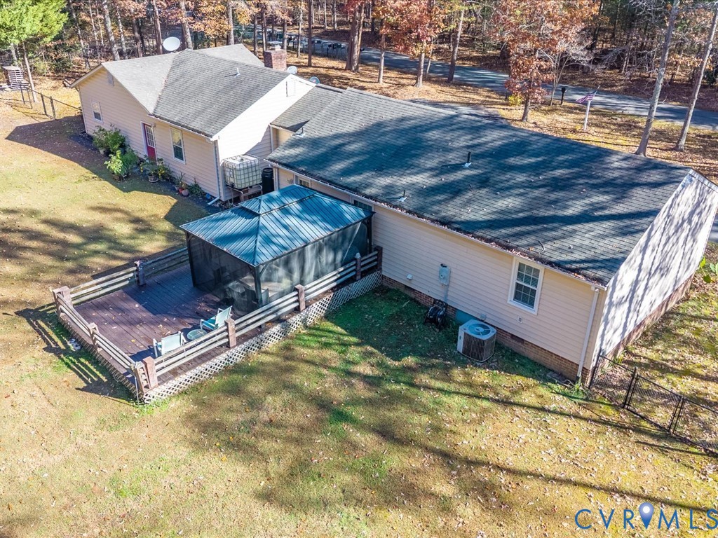 15415 Hopeful Church Road Bumpass, VA 23024 - Photo 23 of 27 a view of a house with a backyard