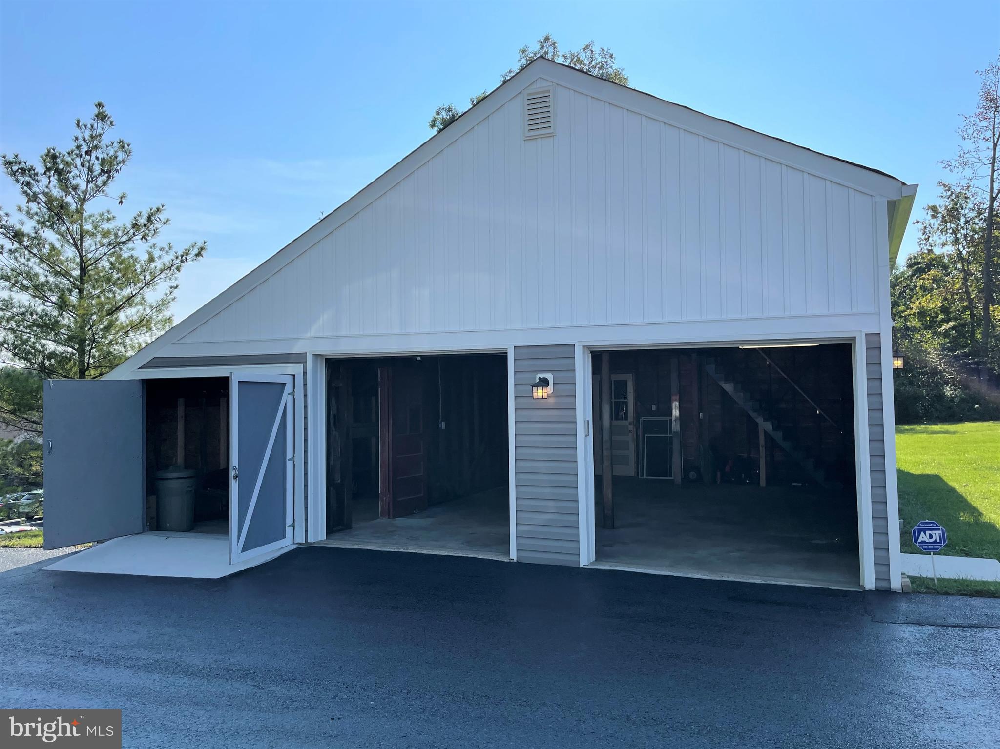 9401 Philadelphia Road Baltimore, MD 21237 - Photo 29 of 46 Detached garage with side and rear storage/barn