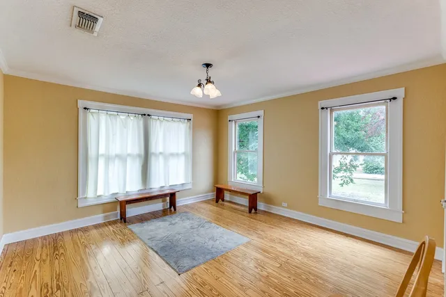 a bathroom with a toilet a sink and a mirror