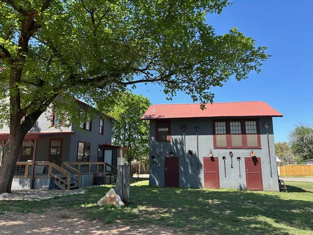 a white toilet sitting next to a shower
