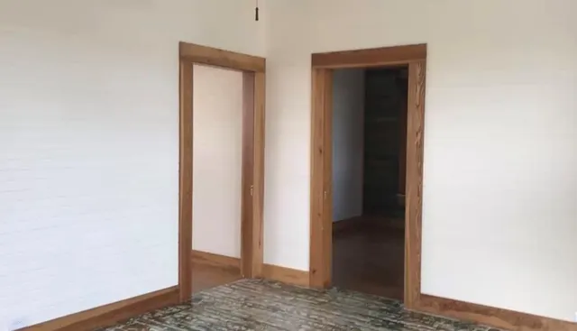 a view of front door with wooden floor