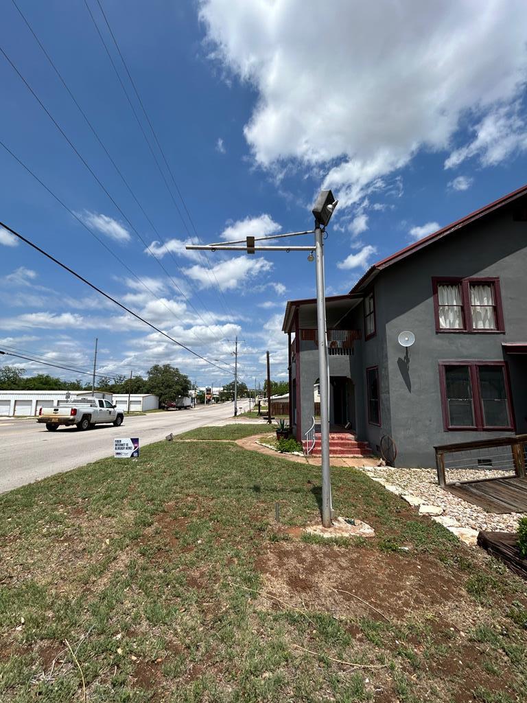 1600 Ford Street Llano, TX 78643 - Photo 8 of 37 a view of a house with a patio and a yard