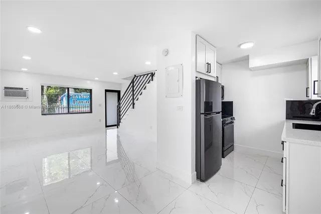 a view of an empty room with windows