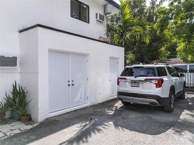 a front view of a house with a yard table and chairs