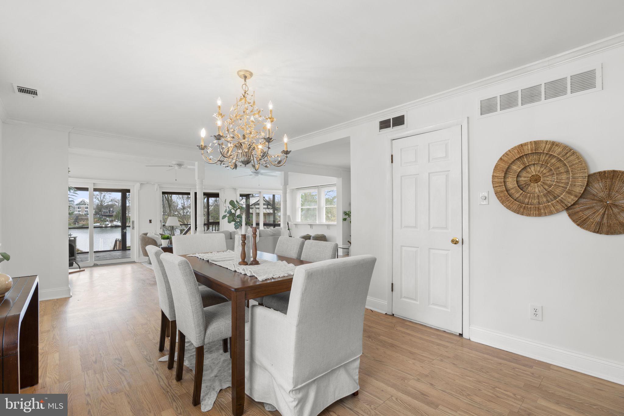 452 Carvel Beach Road Carvel Beach, MD 21226 - Photo 12 of 71 a view of a dining room with furniture and chandelier