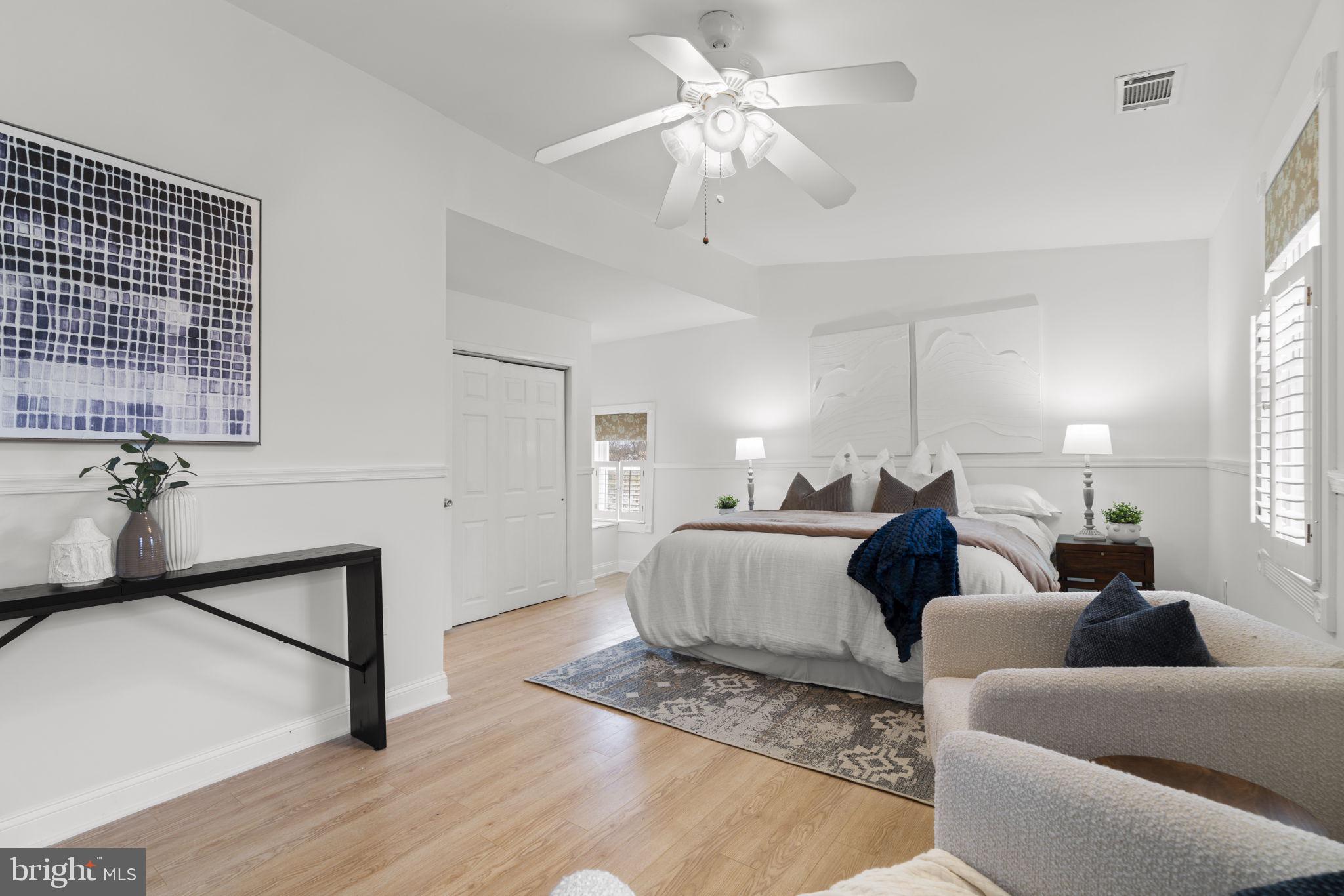 452 Carvel Beach Road Carvel Beach, MD 21226 - Photo 27 of 71 a living room with furniture a chandelier and a window