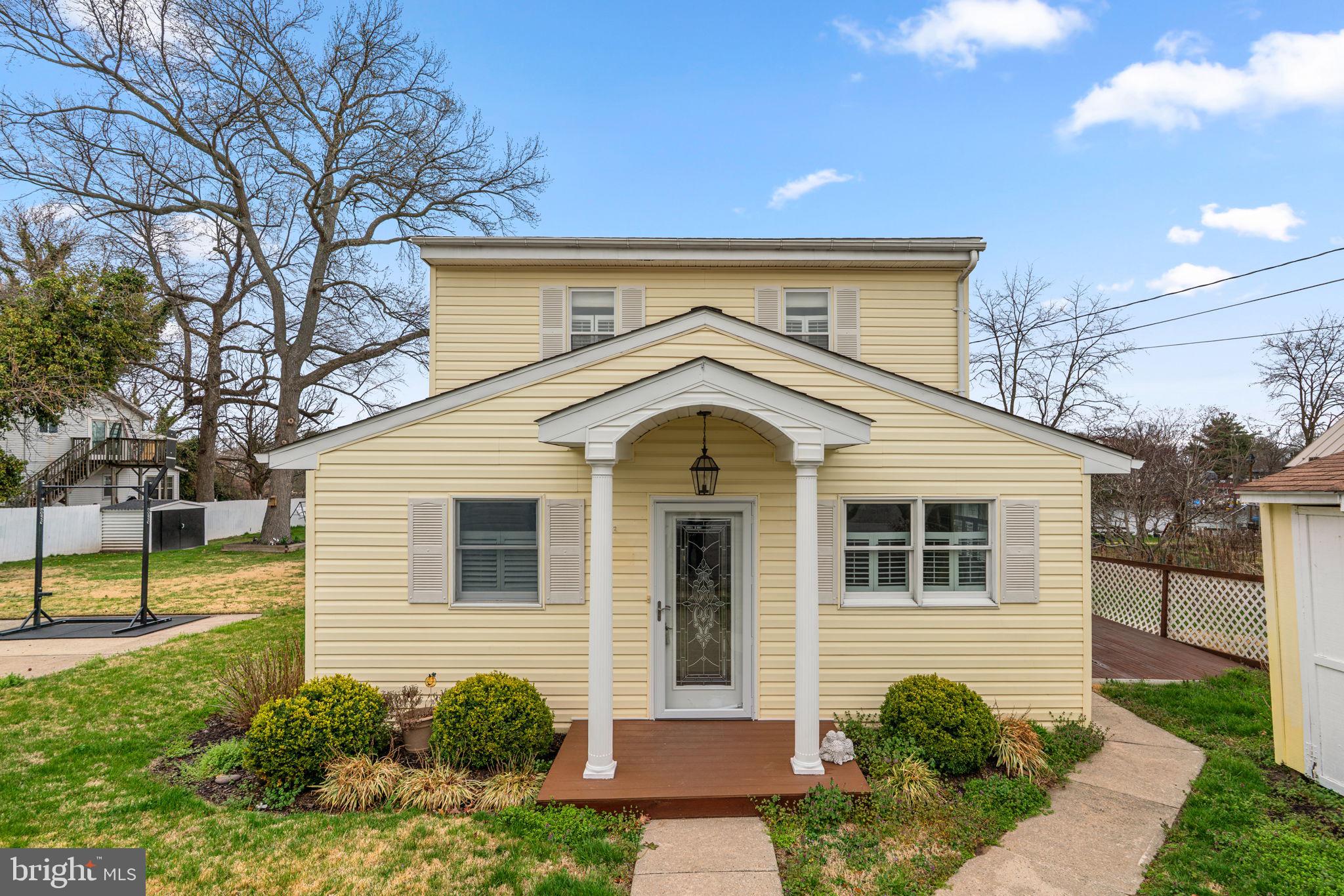 452 Carvel Beach Road Carvel Beach, MD 21226 - Photo 3 of 71 a front view of a house with a yard