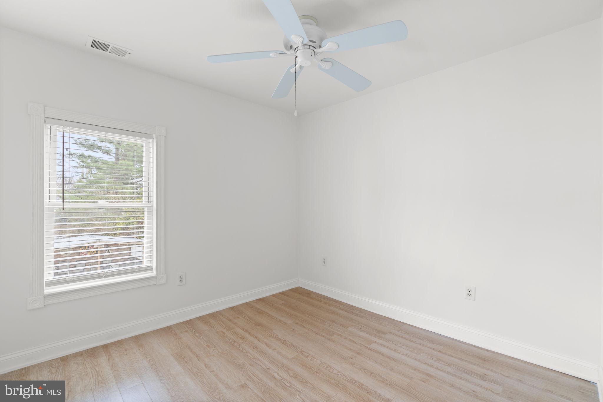 452 Carvel Beach Road Carvel Beach, MD 21226 - Photo 31 of 71 an empty room with a window and wooden floor