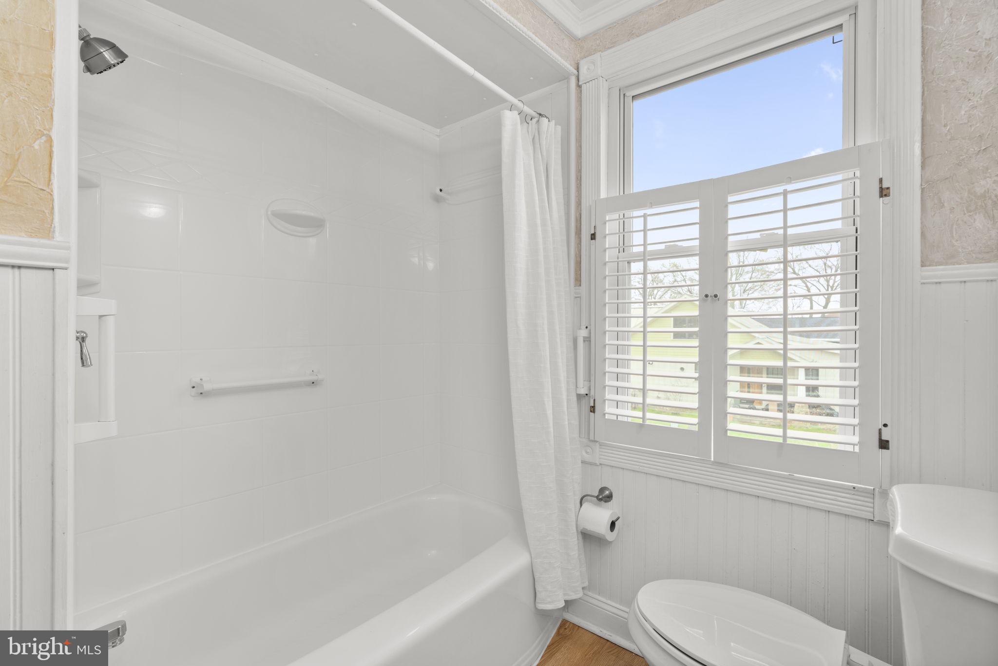 452 Carvel Beach Road Carvel Beach, MD 21226 - Photo 34 of 71 a bathroom with a toilet a bath tub and a window