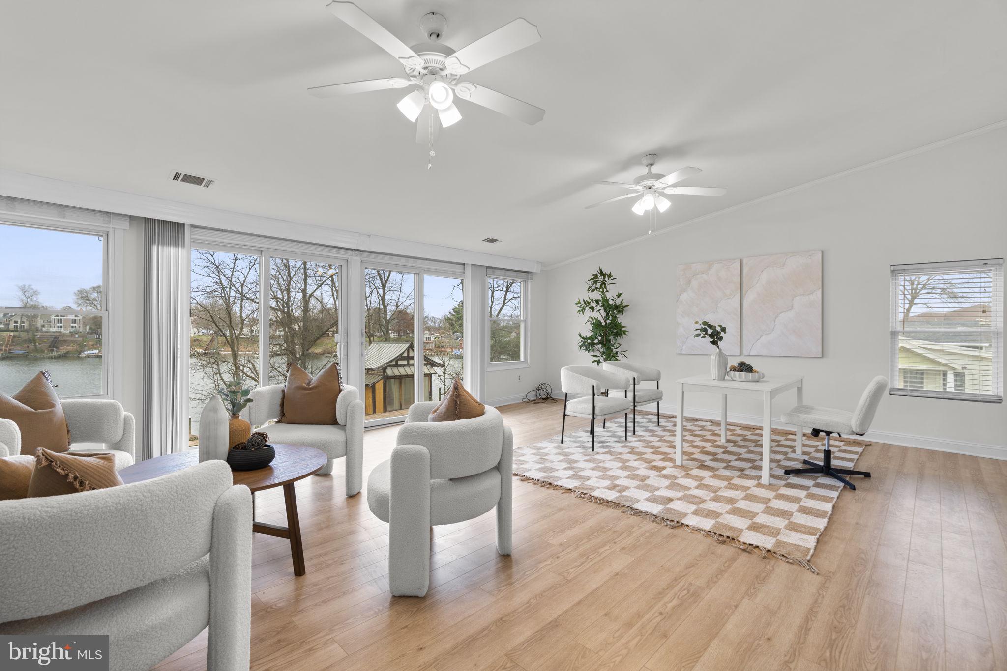 452 Carvel Beach Road Carvel Beach, MD 21226 - Photo 36 of 71 a living room with furniture large window and wooden floor