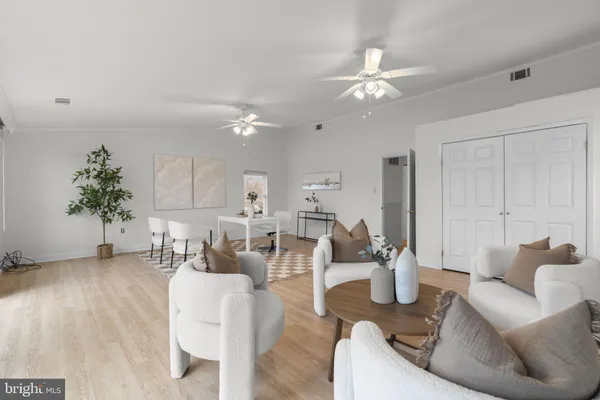 a view of a lake with houses in the back