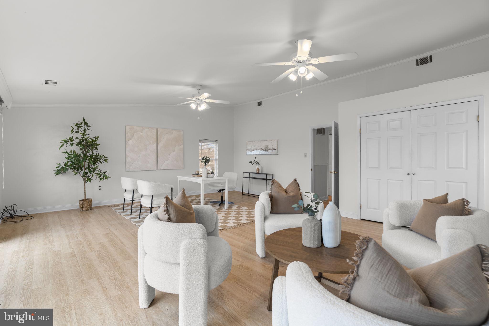 452 Carvel Beach Road Carvel Beach, MD 21226 - Photo 37 of 71 a living room with furniture and a chandelier