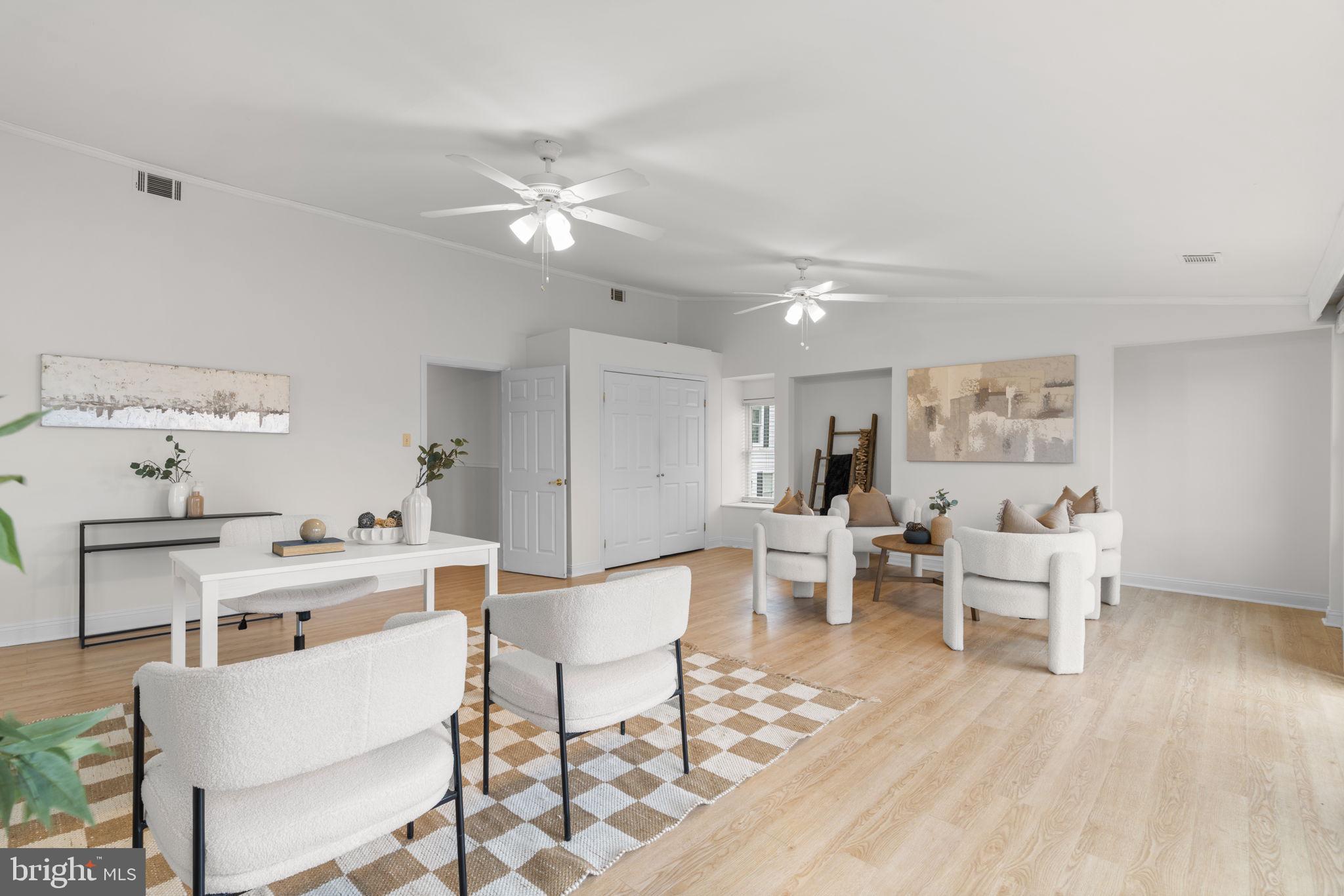 452 Carvel Beach Road Carvel Beach, MD 21226 - Photo 38 of 71 a living room with furniture a dining table and kitchen view
