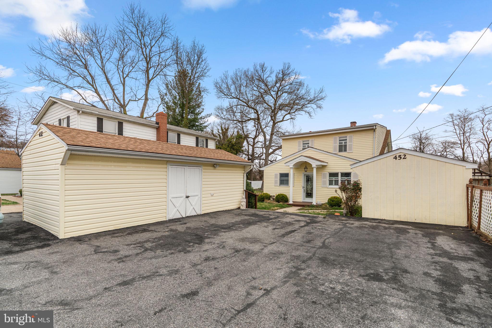 452 Carvel Beach Road Carvel Beach, MD 21226 - Photo 40 of 71 a front view of a house with a yard and garage